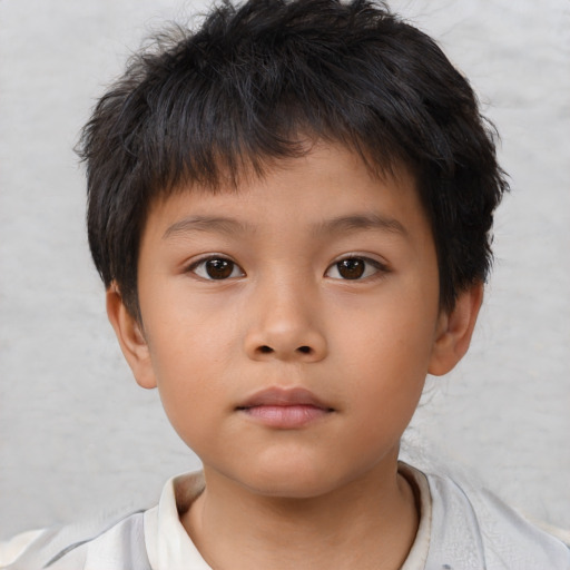 Neutral asian child male with short  brown hair and brown eyes