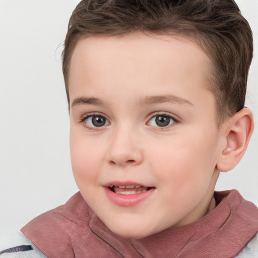 Joyful white child female with short  brown hair and grey eyes