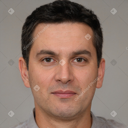 Joyful white adult male with short  brown hair and brown eyes