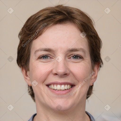 Joyful white adult female with short  brown hair and grey eyes