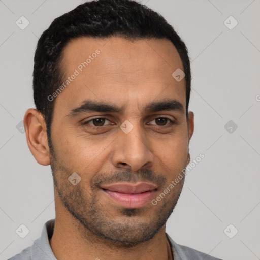 Joyful white young-adult male with short  black hair and brown eyes