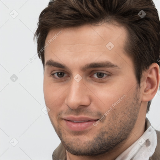 Joyful white young-adult male with short  brown hair and brown eyes