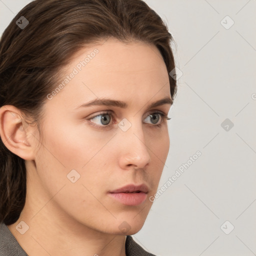 Neutral white young-adult female with medium  brown hair and grey eyes