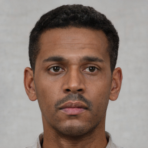 Neutral latino young-adult male with short  brown hair and brown eyes