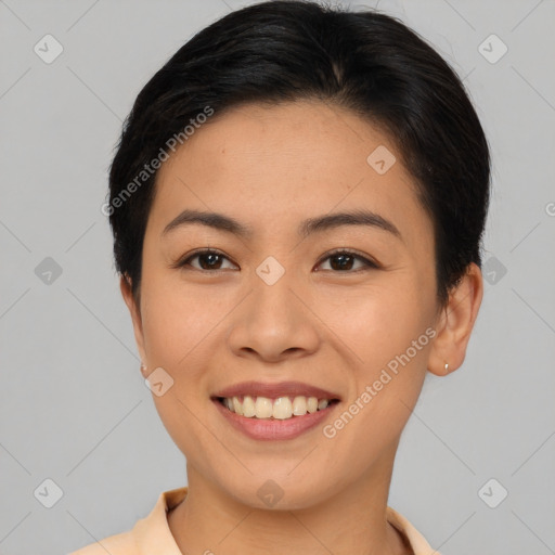 Joyful asian young-adult female with short  brown hair and brown eyes