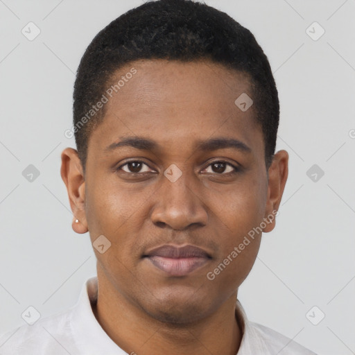 Joyful black young-adult male with short  brown hair and brown eyes