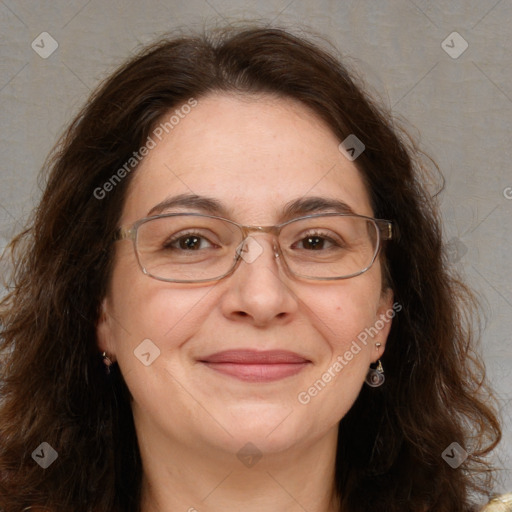 Joyful white adult female with long  brown hair and brown eyes