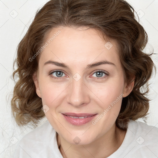 Joyful white young-adult female with medium  brown hair and blue eyes