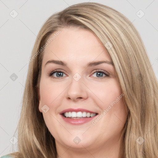 Joyful white young-adult female with long  brown hair and blue eyes