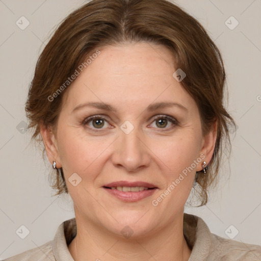 Joyful white adult female with medium  brown hair and grey eyes