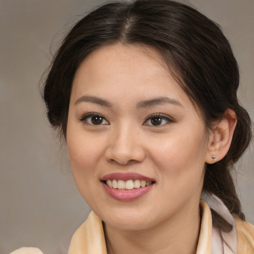 Joyful white young-adult female with medium  brown hair and brown eyes