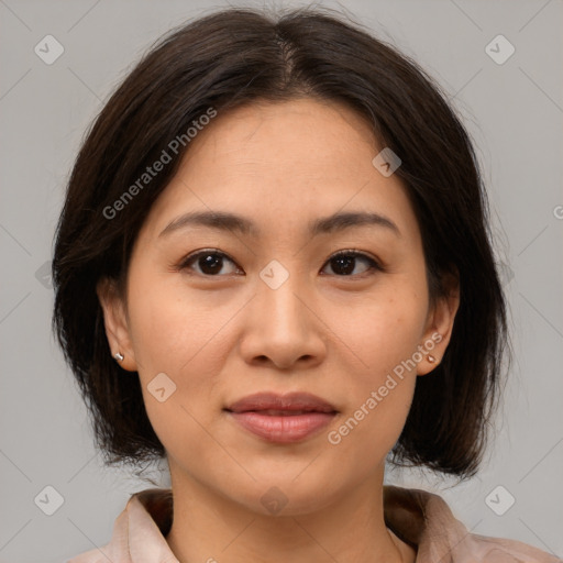 Joyful asian young-adult female with medium  brown hair and brown eyes