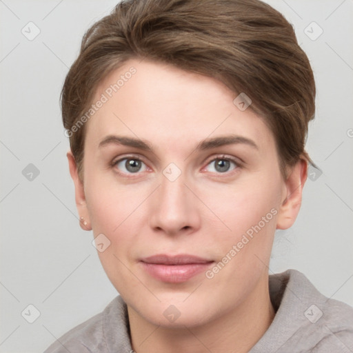 Joyful white young-adult female with short  brown hair and grey eyes