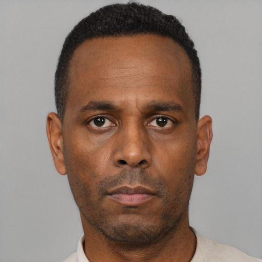 Neutral black adult male with short  brown hair and brown eyes