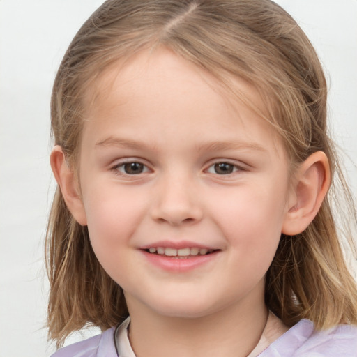 Joyful white child female with medium  brown hair and brown eyes