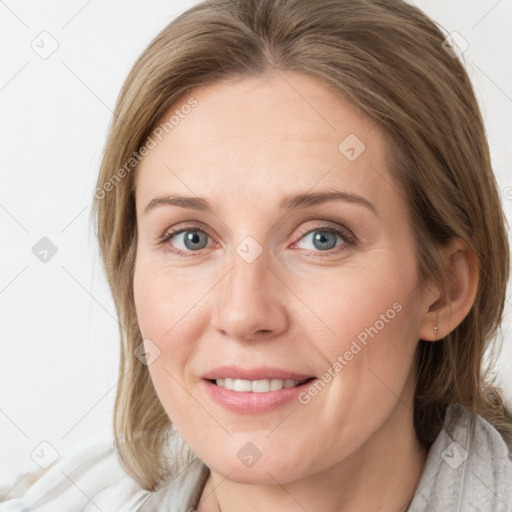 Joyful white young-adult female with medium  brown hair and blue eyes