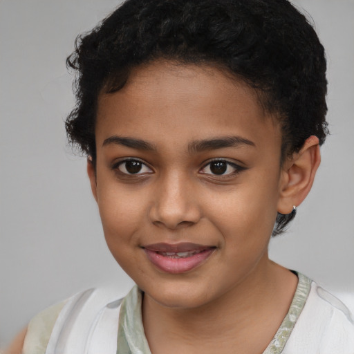 Joyful latino child female with short  brown hair and brown eyes