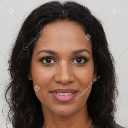 Joyful black young-adult female with long  brown hair and brown eyes