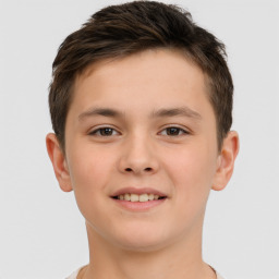 Joyful white child male with short  brown hair and brown eyes