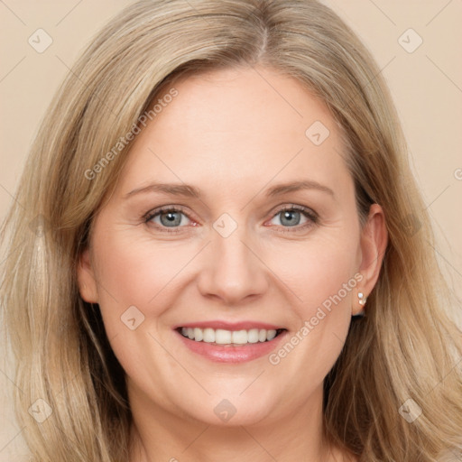 Joyful white adult female with medium  brown hair and grey eyes