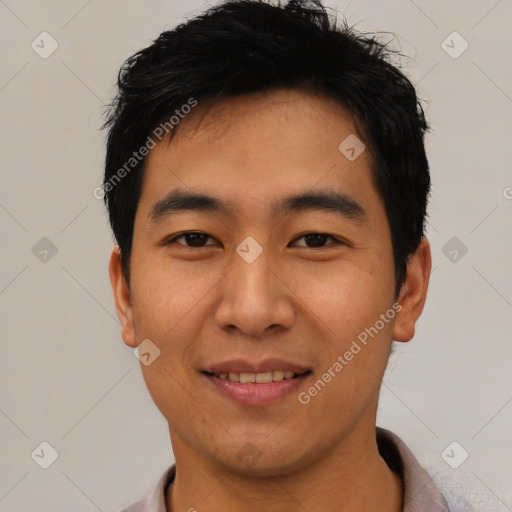 Joyful asian young-adult male with short  black hair and brown eyes