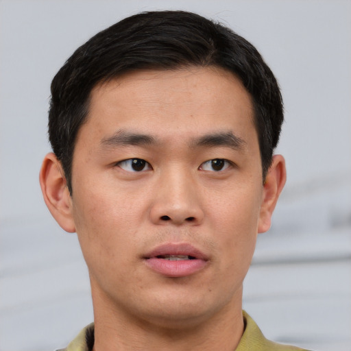 Neutral asian young-adult male with short  brown hair and brown eyes