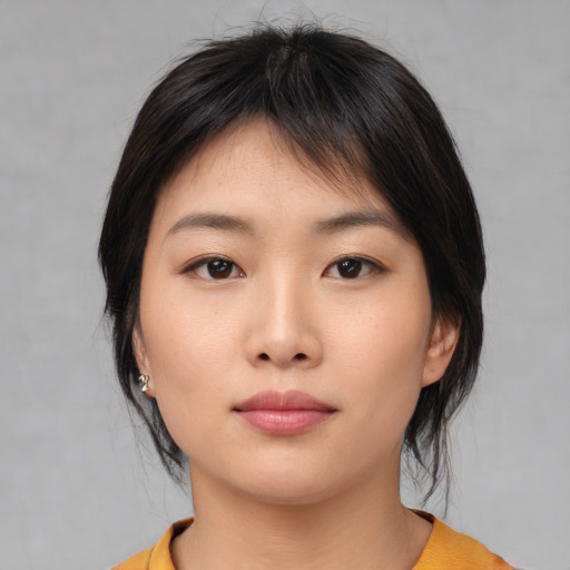 Neutral asian young-adult female with medium  brown hair and brown eyes