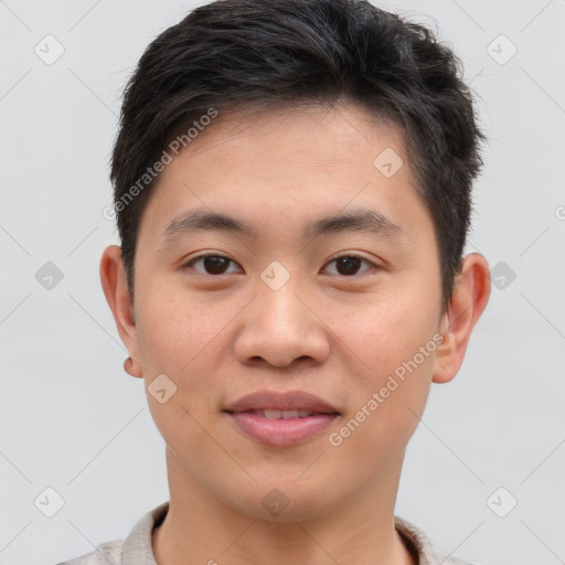 Joyful asian young-adult male with short  brown hair and brown eyes