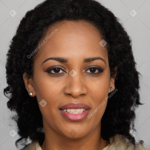 Joyful black young-adult female with long  brown hair and brown eyes