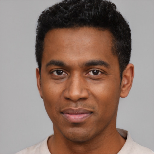 Neutral black young-adult male with short  black hair and brown eyes