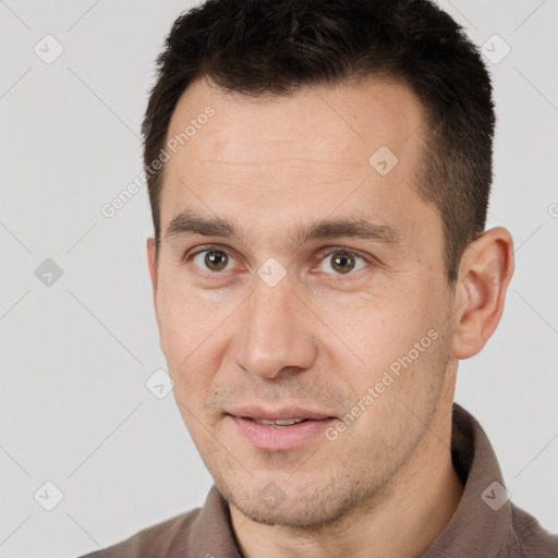 Joyful white adult male with short  brown hair and brown eyes