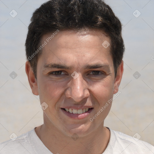 Joyful white adult male with short  brown hair and brown eyes