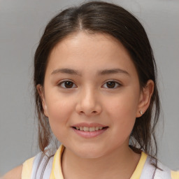 Joyful white child female with medium  brown hair and brown eyes