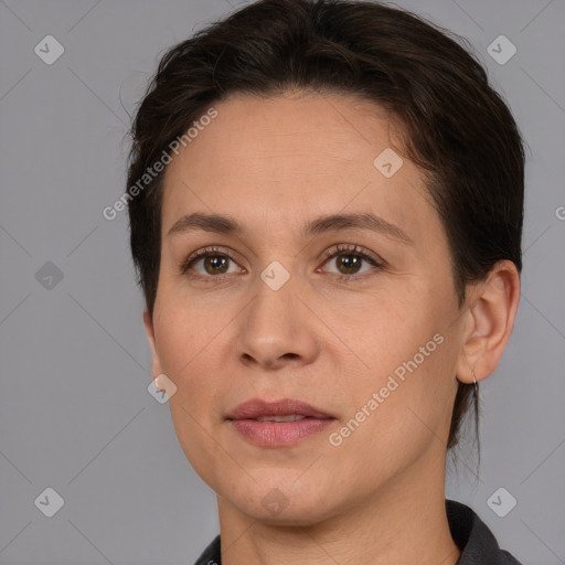 Joyful white adult female with short  brown hair and brown eyes