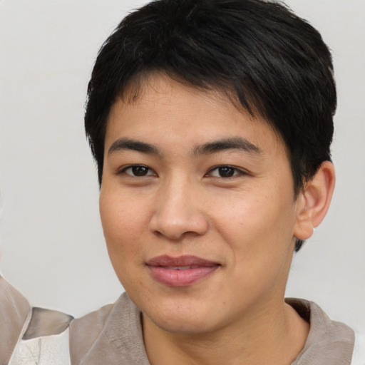 Joyful asian young-adult male with short  brown hair and brown eyes