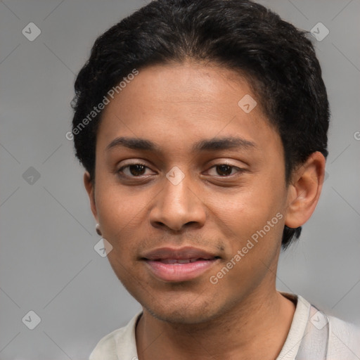 Joyful latino young-adult male with short  black hair and brown eyes