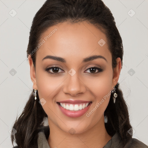 Joyful latino young-adult female with long  brown hair and brown eyes