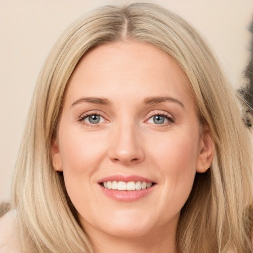 Joyful white young-adult female with long  brown hair and green eyes