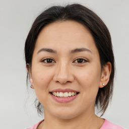 Joyful asian young-adult female with medium  brown hair and brown eyes