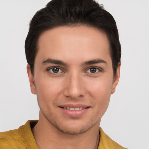 Joyful white young-adult male with short  brown hair and brown eyes