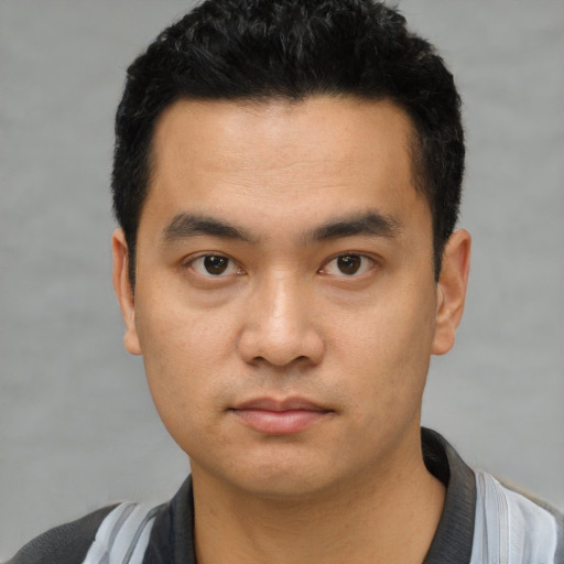 Neutral asian young-adult male with short  black hair and brown eyes