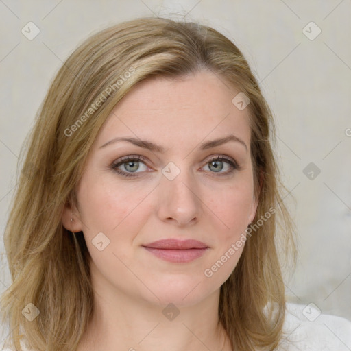 Joyful white young-adult female with medium  brown hair and blue eyes