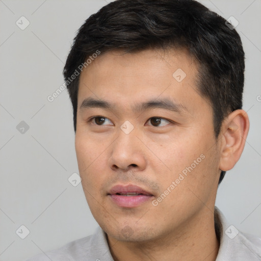 Neutral asian young-adult male with short  black hair and brown eyes