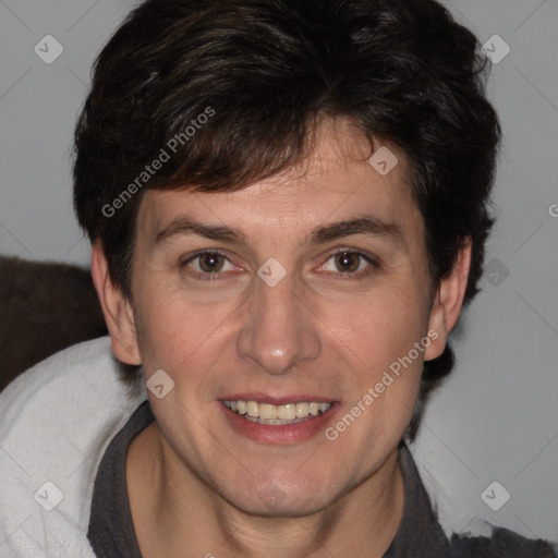 Joyful white adult male with medium  brown hair and brown eyes