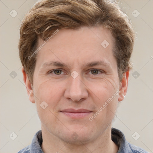 Joyful white adult male with short  brown hair and grey eyes