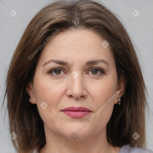 Joyful white adult female with medium  brown hair and brown eyes