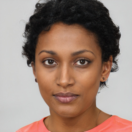 Neutral black young-adult female with short  black hair and brown eyes