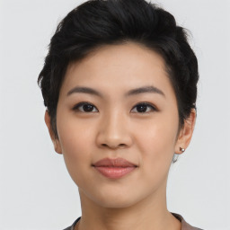 Joyful asian young-adult female with short  black hair and brown eyes