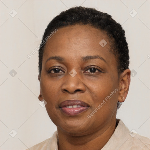 Joyful black adult female with short  brown hair and brown eyes