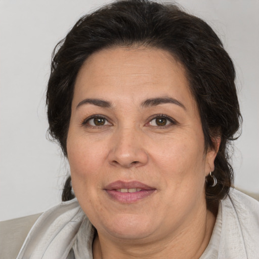 Joyful white adult female with medium  brown hair and brown eyes